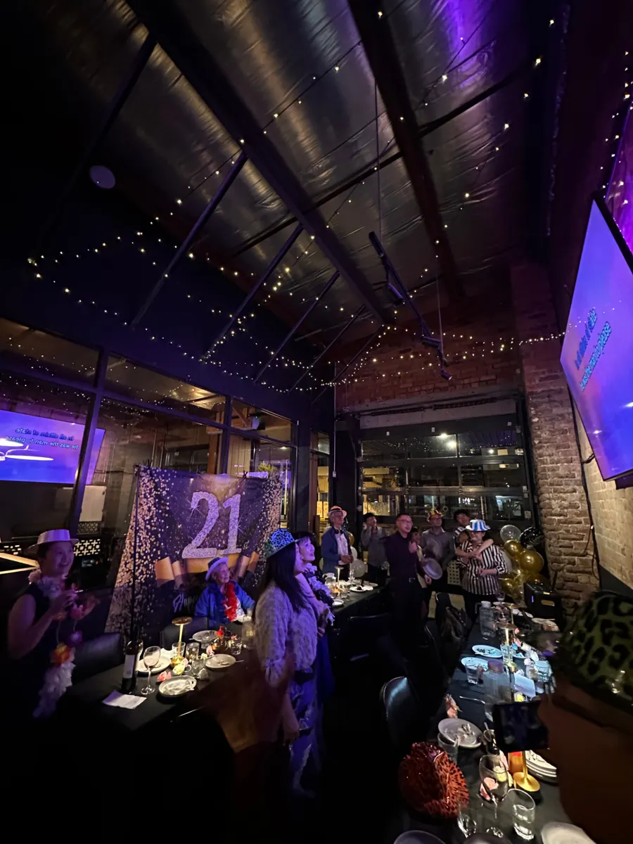 A 21st birthday party with balloons and karaoke