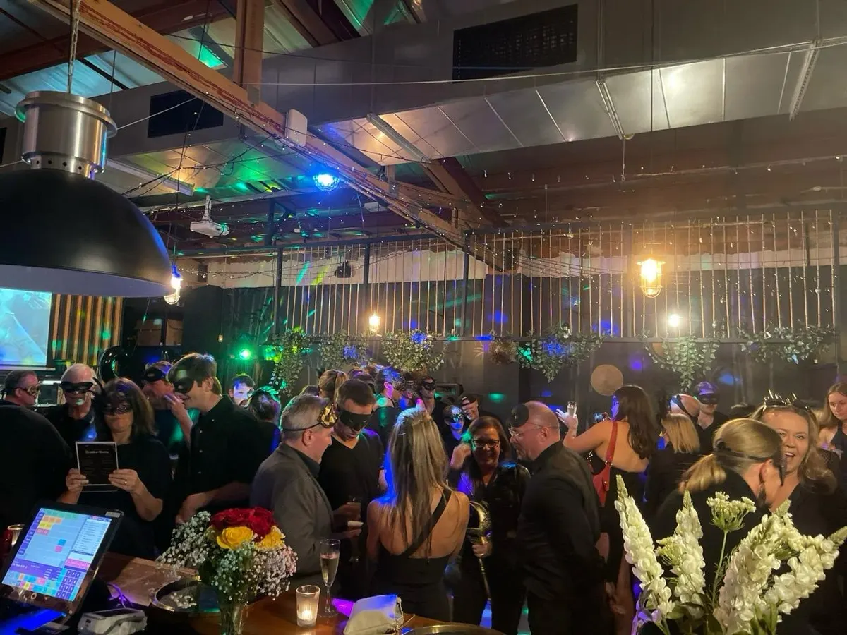 A packed masquerade party across the venue